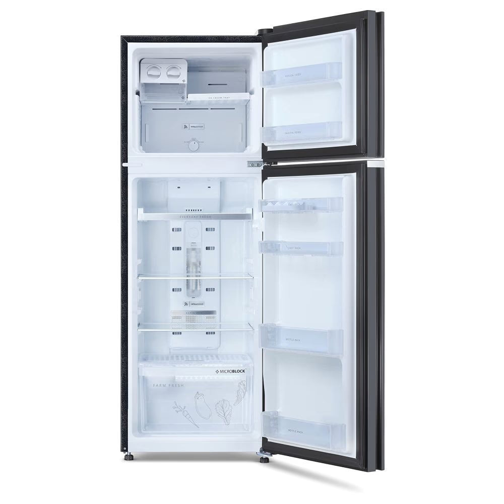 Inside view of Whirlpool Neo 278GD PRM frost free refrigerator showing toughened glass shelves and vegetable crisper
